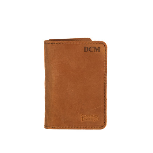 This is a monogrammed tan brown leather business card holder wallet.