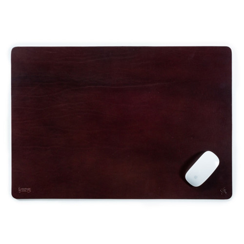 This is a dark reddish brown leather desk pad with a mouse on it.