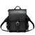 This is a black leather backpack that is front facing and waiting for you to put it on your back.