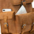 The pockets on this tan leather backpack have a pocket behind the pocket.