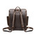 This is a dark brown leather backpack with a pocket on the back side.