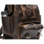 This is a dark brown leather backpack with a pocket.