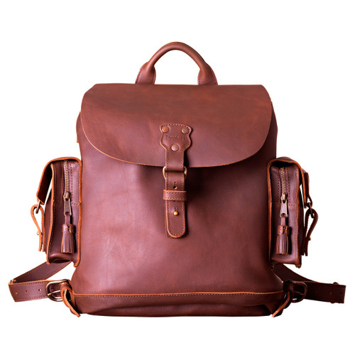 This red brown women's brown leather backpack is facing forward.