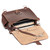 This is the open view of a reddish brown rounded leather satchel.