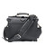 This is the back view with the strap of a black rounded leather satchel.