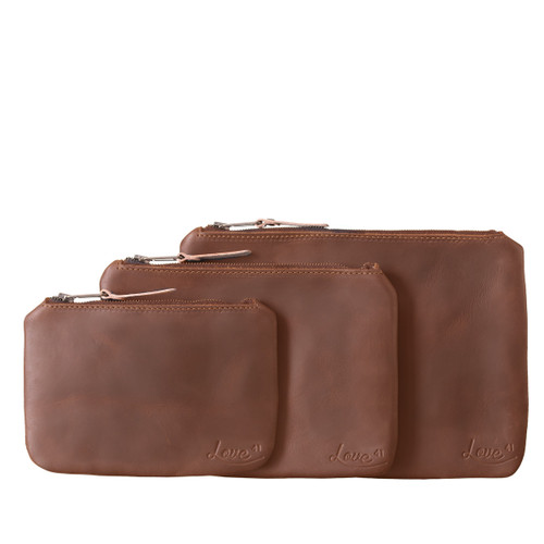 This is the chestnut view of the set of three leather pouches