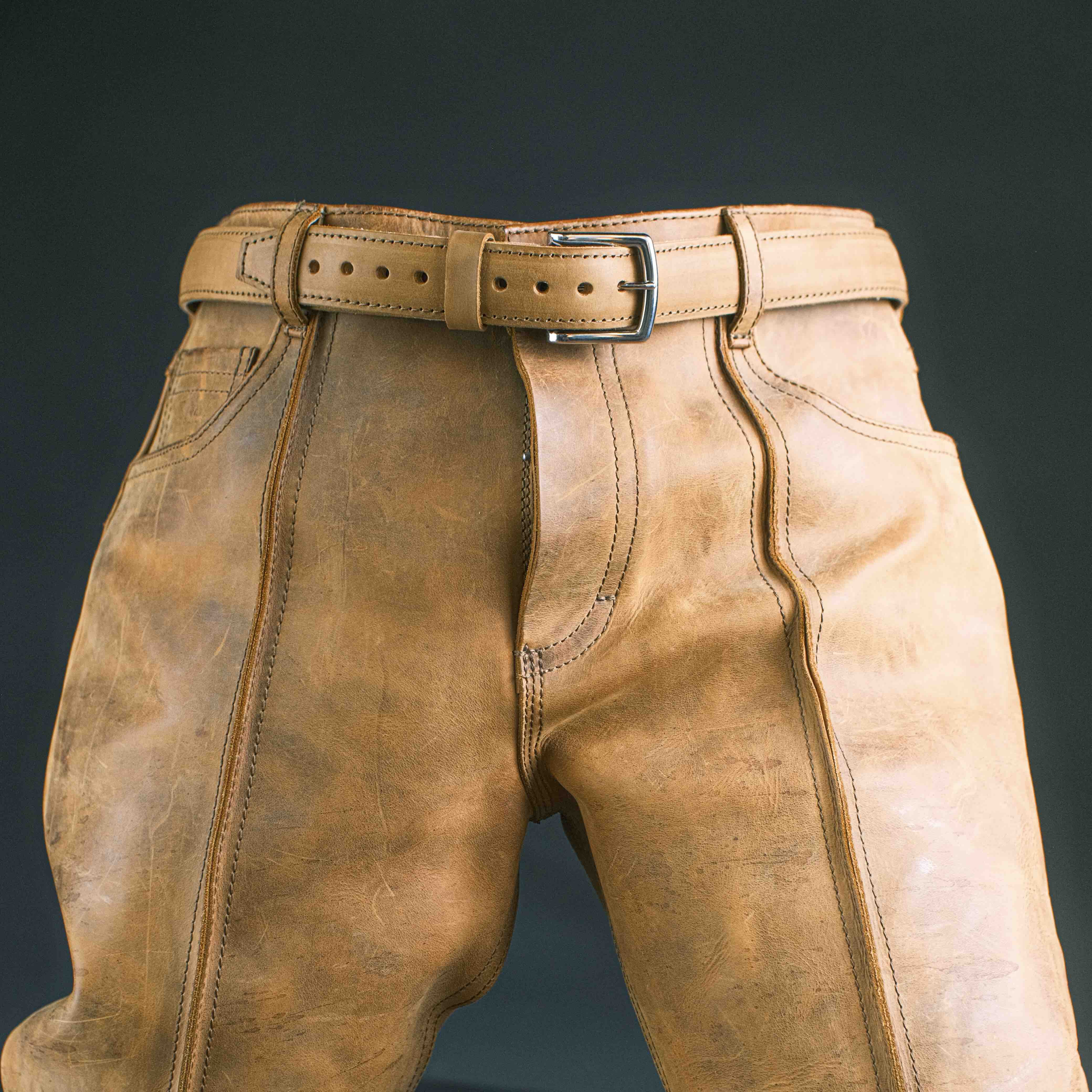 This belt is designed to be sturdy and durable, with nine holes that are three-quarters of an inch apart, starting two inches from the tip.