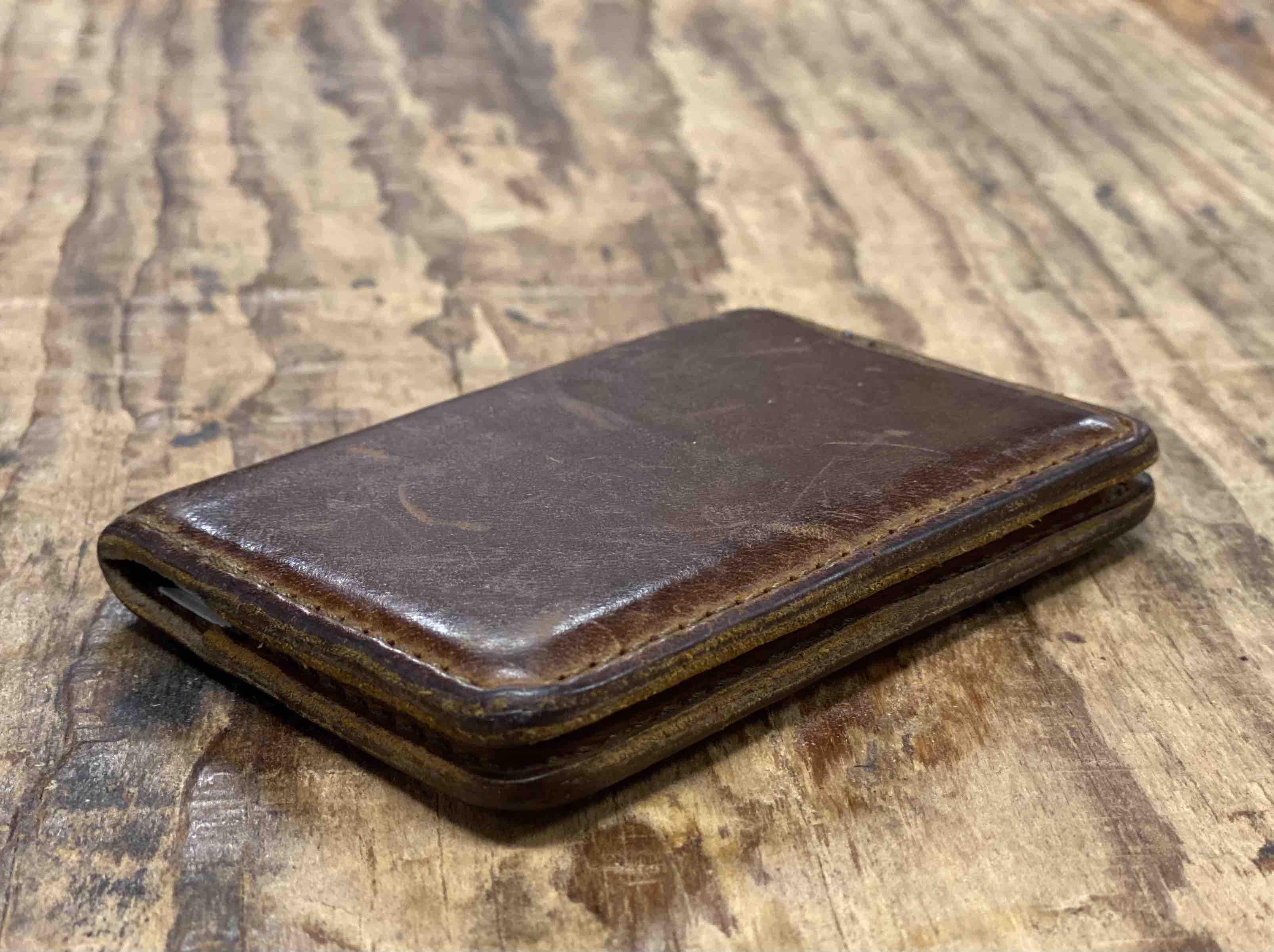 Leather business card holder that has been used and now has a nice patina. Some use it as a minimalist wallet