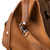 Close-up side view of Saddleback Leather's Deep Pocket Leather Duffle Bag in Tan Brown / Tobacco