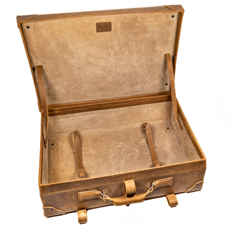 Saddleback Leather suitcase open and empty.