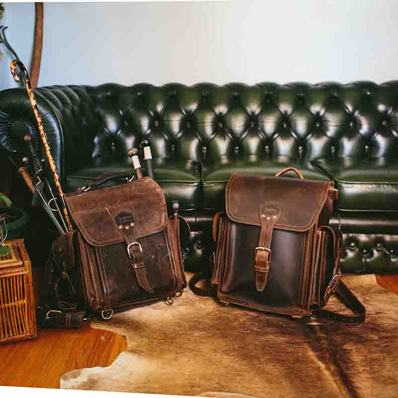 The full grain leather Tank backpack has a laptop pocket on the front and one in the back, which can fit a 17" laptop. It also has tall side pockets with hidden pockets behind them for quick access or for sticking in longer things, as well as lower and side d-rings for securing tripods, blankets, and dirty and wet shoes.